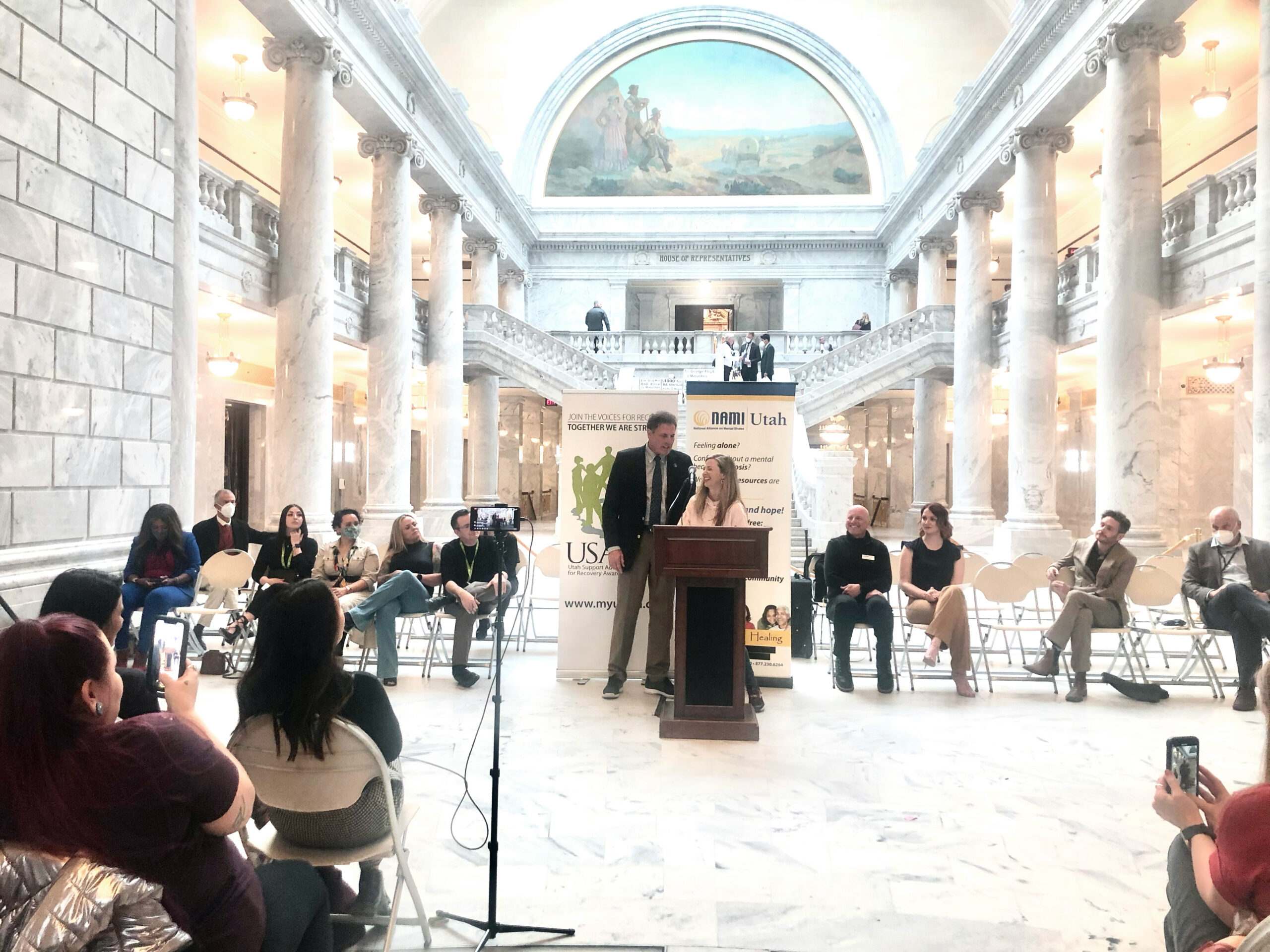 4.a.1 Press conference after the passing of the Utah Clean Slate Law. Noella Sudbury, J.D. is standing at the podium with Representative James A. Dunnigan in the State Capitol Building