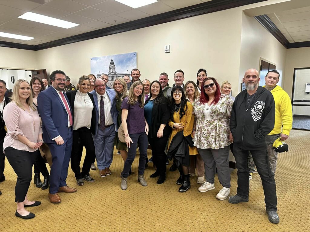 Group photo of advocates and impacted people at the Utah state capitol